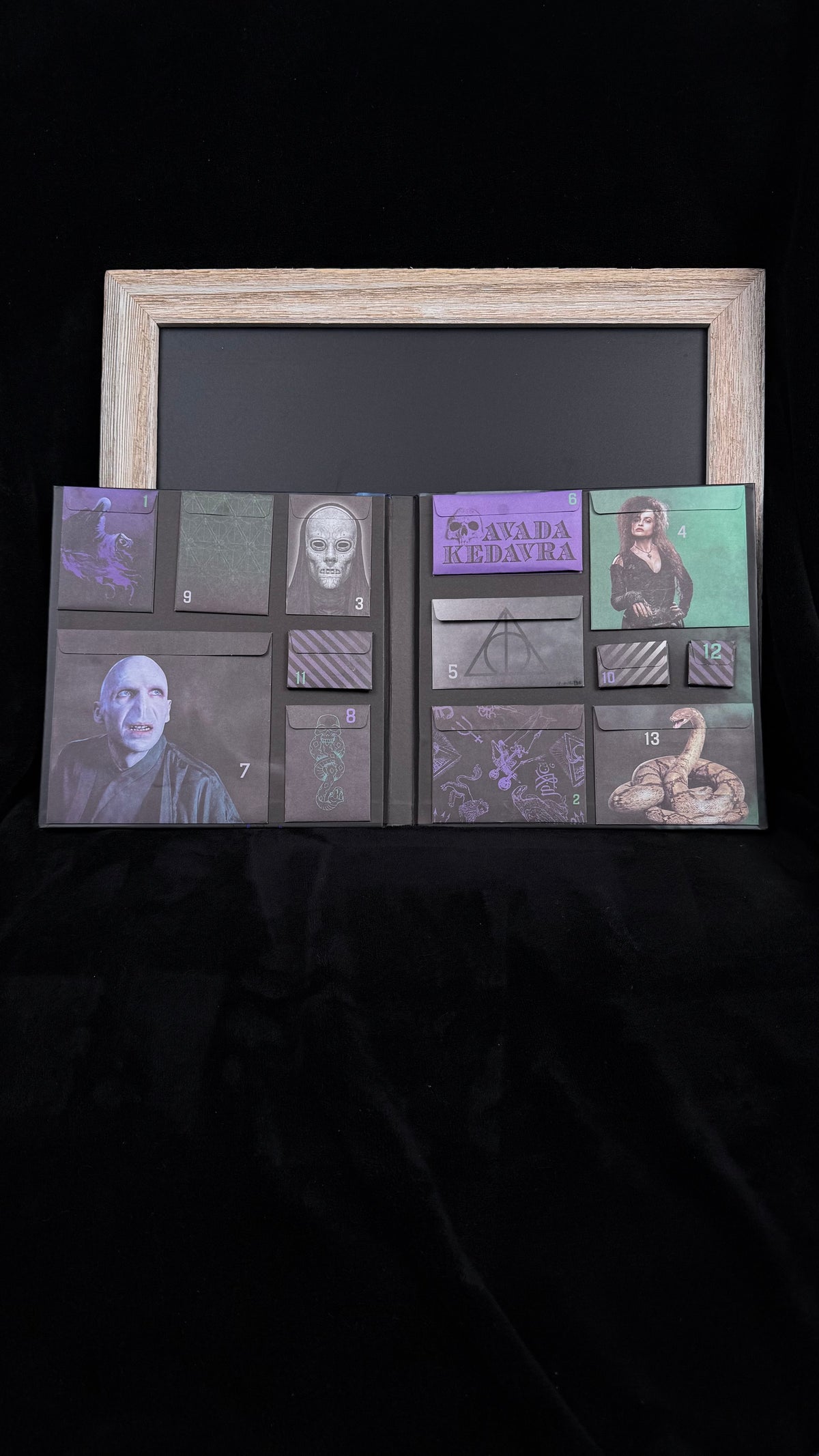 Inside the Harry Potter Dark Arts countdown calendar showing all 13 numbered envelope pockets, sealed