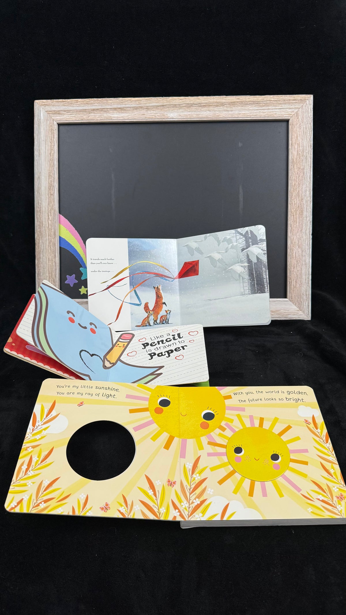 Inside the You Are Loved board books, showing the die-cut sun window spread