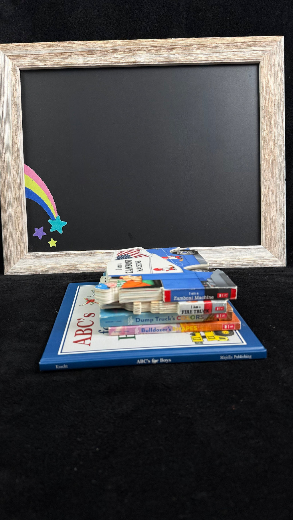 Rainbow Joy Book Shop Red bundle flat lay, vehicle-themed board books