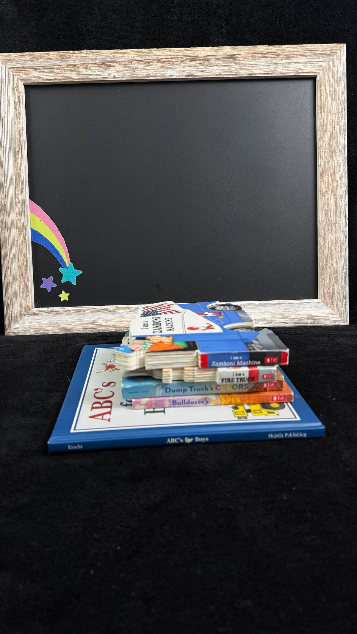 Rainbow Joy Book Shop Red bundle flat lay, vehicle-themed board books