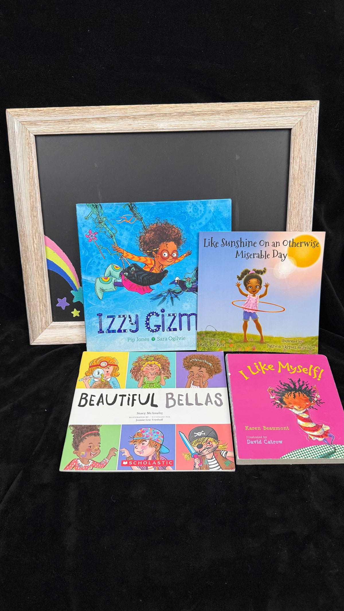 All four self esteem picture books shown together, each featuring a brown girl on the cover