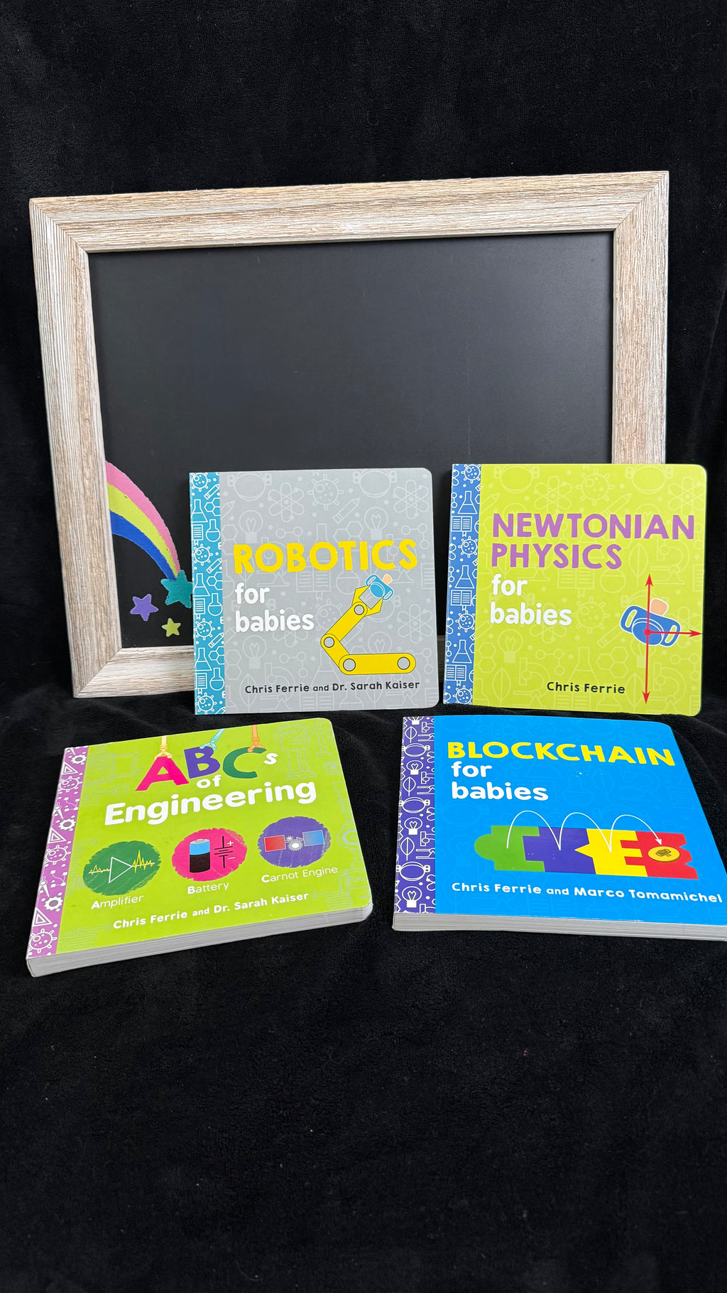 Baby STEM board book bundle flat lay with chalkboard rainbow prop
