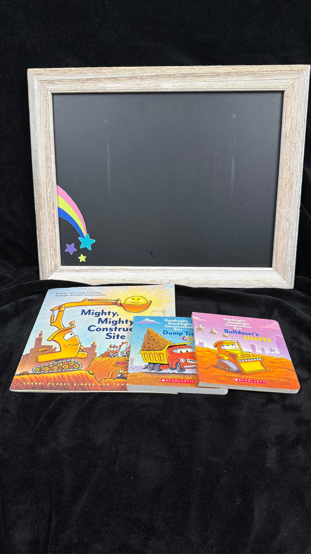 All three construction site books laid out to show each cover